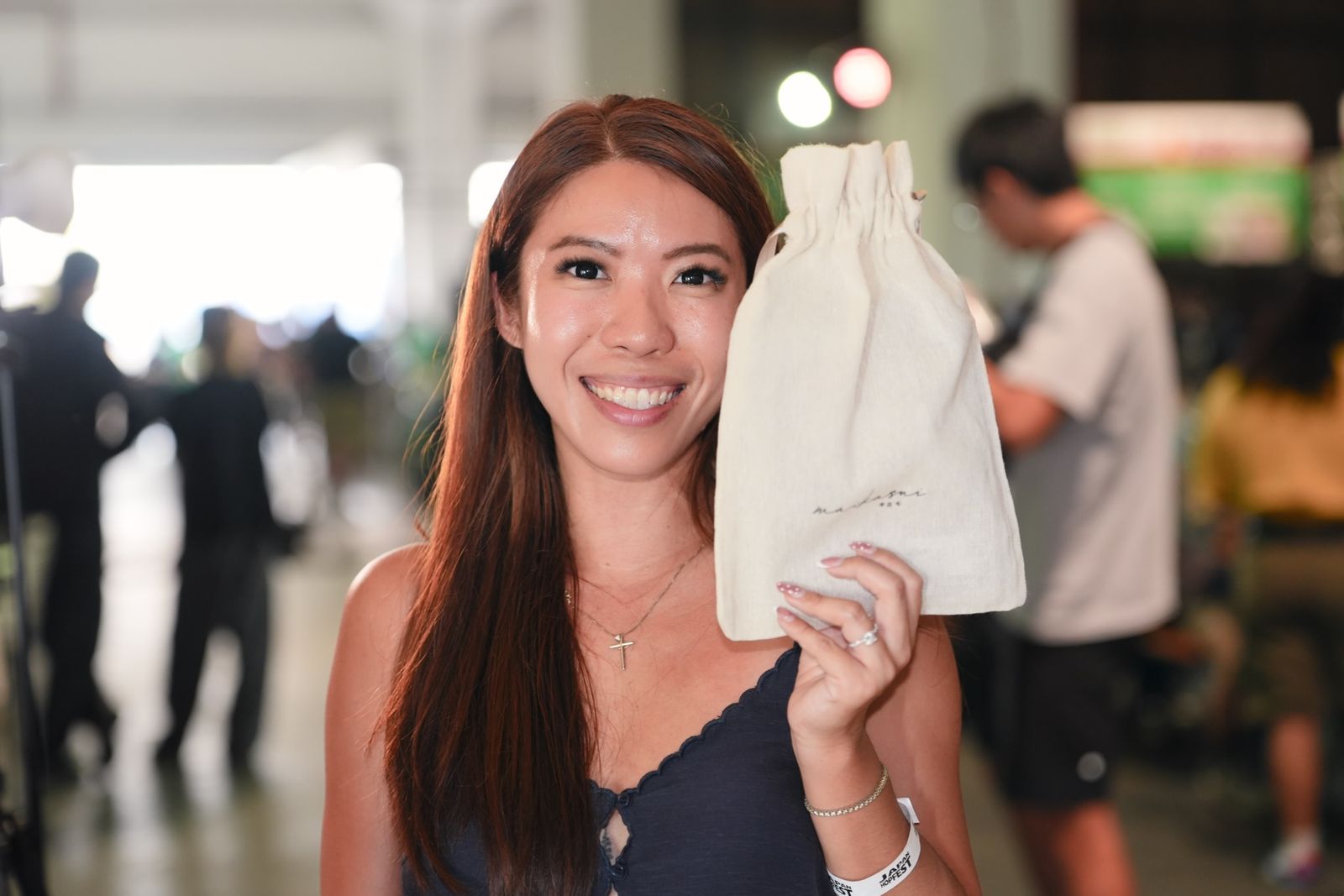 A happy festival-goer with her tote