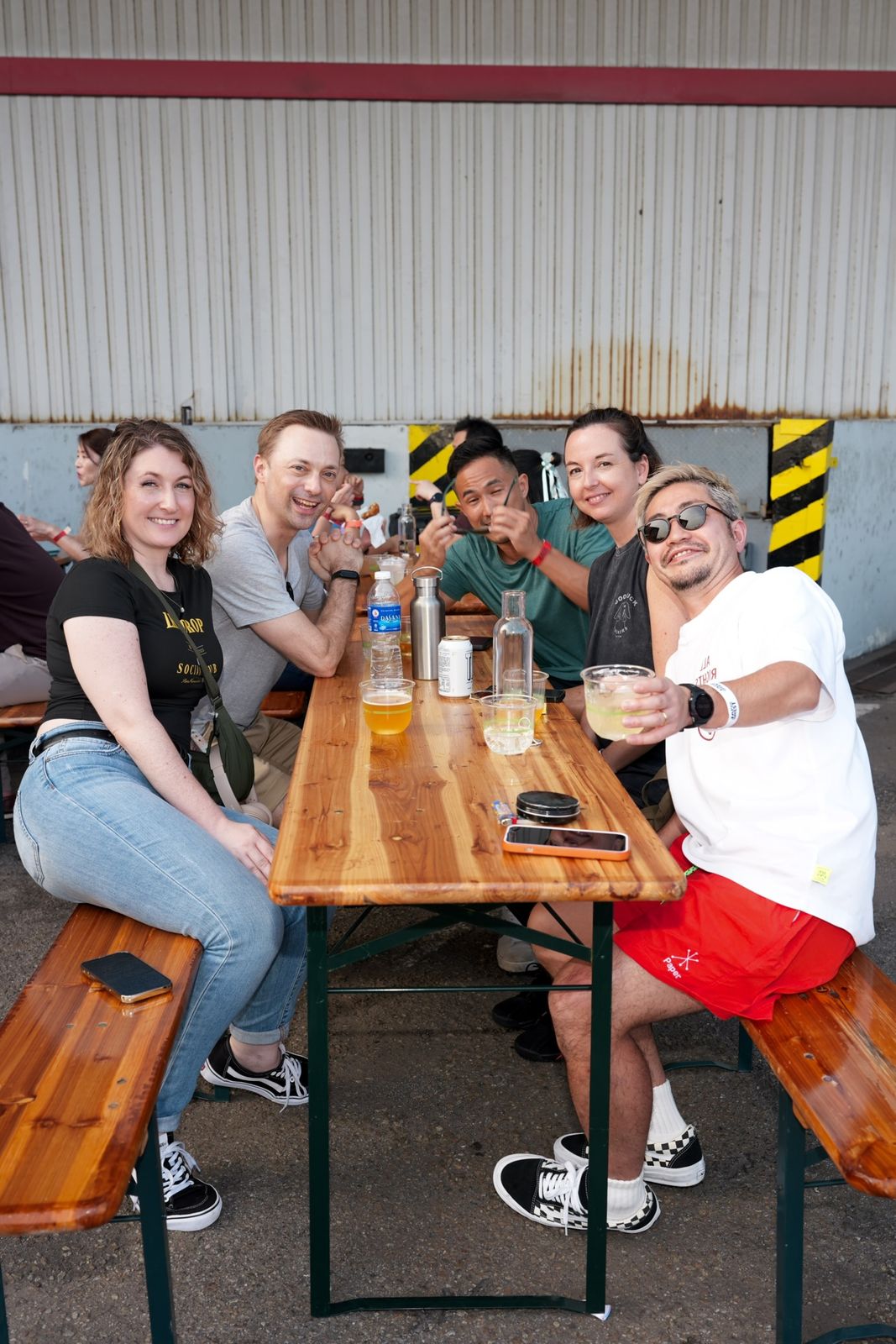 Friends gathered around a beer table