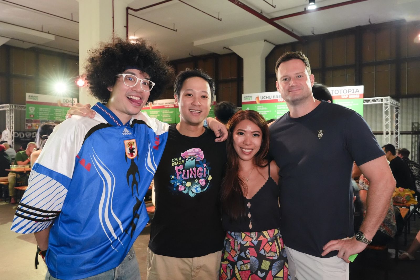 Four friends smiling together at HopFest